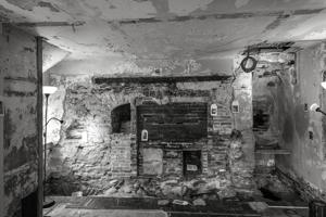 Kitchen fireplaced filled in for stove in 1868